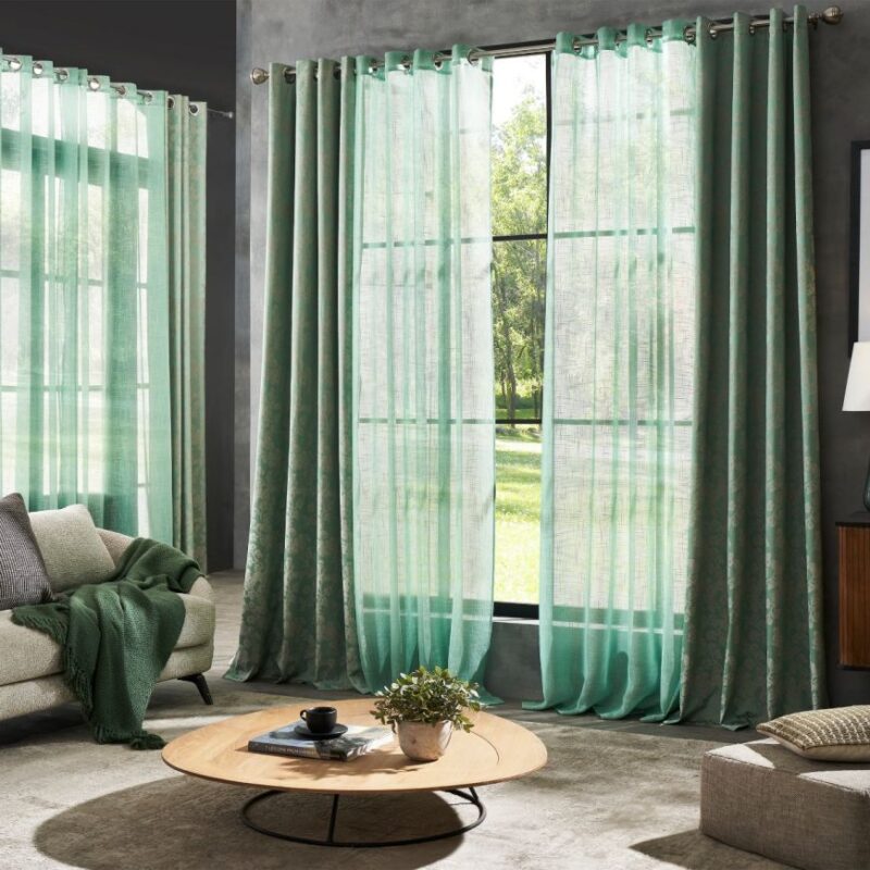 Elegant home curtains Dubai in modern living room with wall to wall carpet Dubai and luxury carpet interior setup.